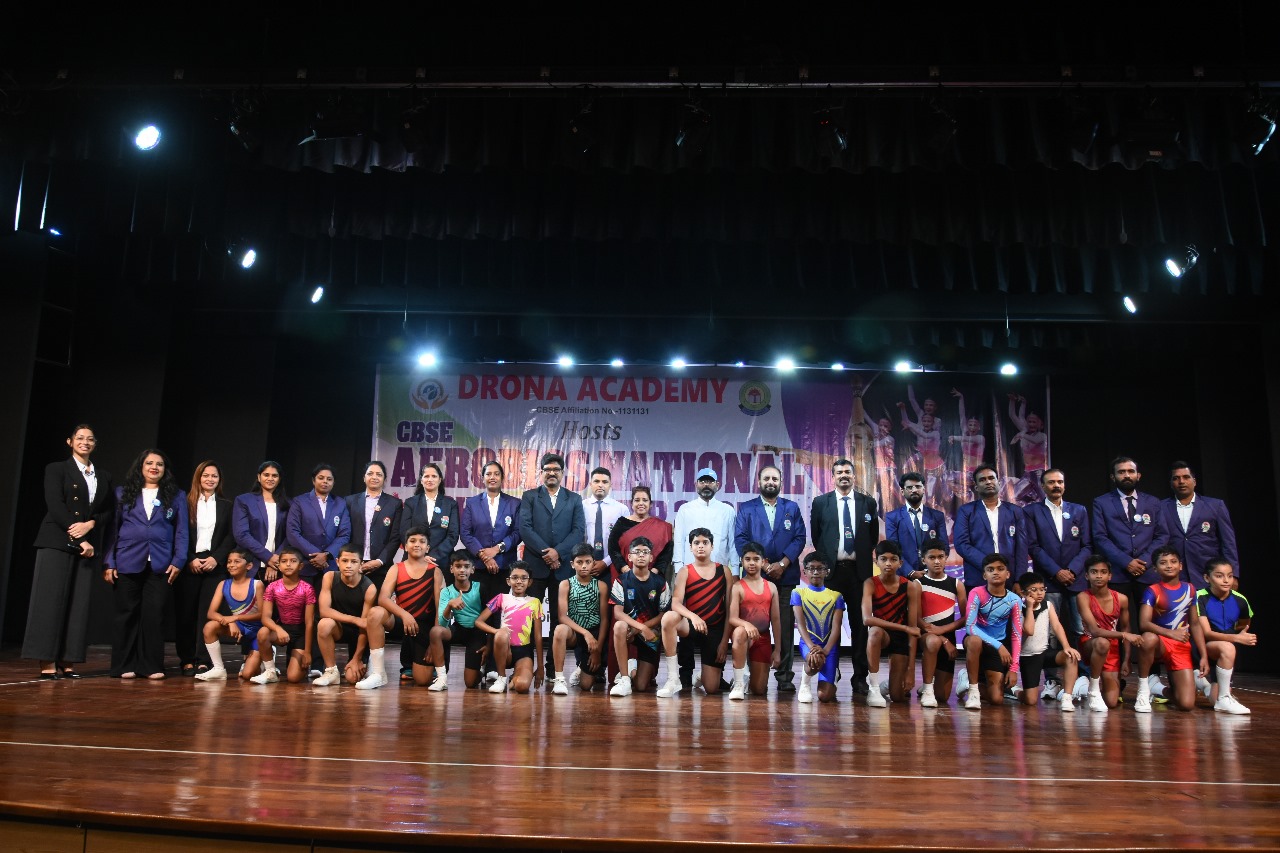 top gymnastics aerobics session Erode, student aerobics performance, certified fitness coaching Erode